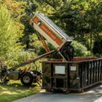 equipter roofing tools dumping material in dumpster